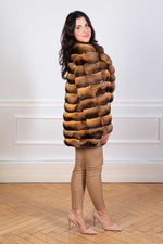 Load image into Gallery viewer, Gold tone chinchilla fur coat seen from the side
