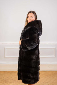 Saga black mink coat with hoody seen from the side