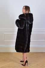 Load image into Gallery viewer, Beautiful Saga black mink coat with hoody seen from the back
