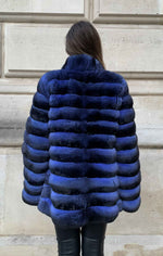 Load image into Gallery viewer, a blue chinchilla coat for women seen from the back

