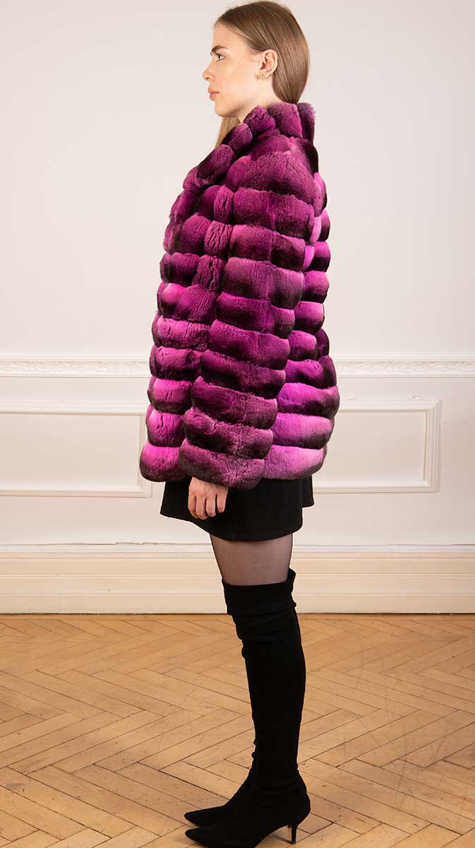 Stunning chinchilla fur coat in magenta pink seen from the side