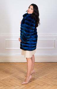 Chinchilla fur coat for women in blue colour seen from the side