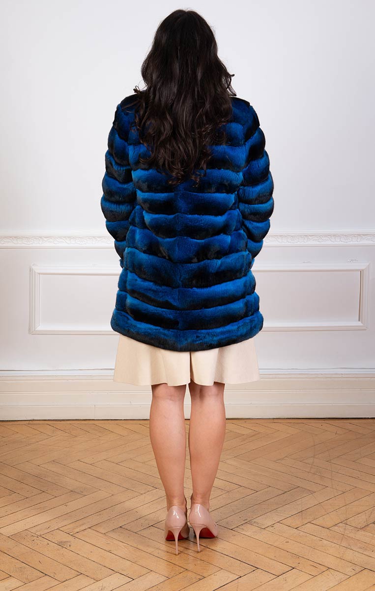 Chinchilla fur coat in blue seen from the back
