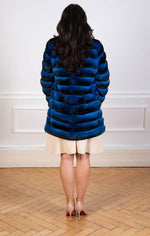Load image into Gallery viewer, Chinchilla fur coat in blue seen from the back
