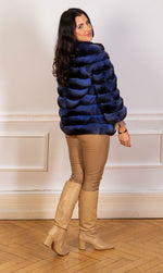 Load image into Gallery viewer, chinchilla fur jacket in light blue seen from the back
