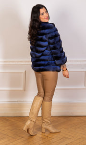 chinchilla fur jacket in light blue seen from the back