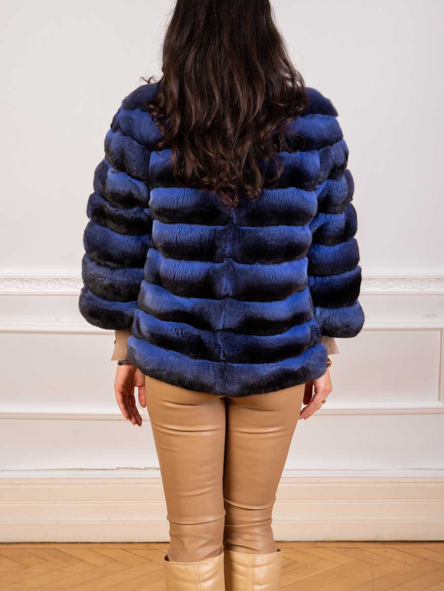 chinchilla fur jacket in light blue closeup seen from the back
