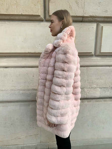 Chinchilla fur coat for women in a mellow rose tone seen from the side