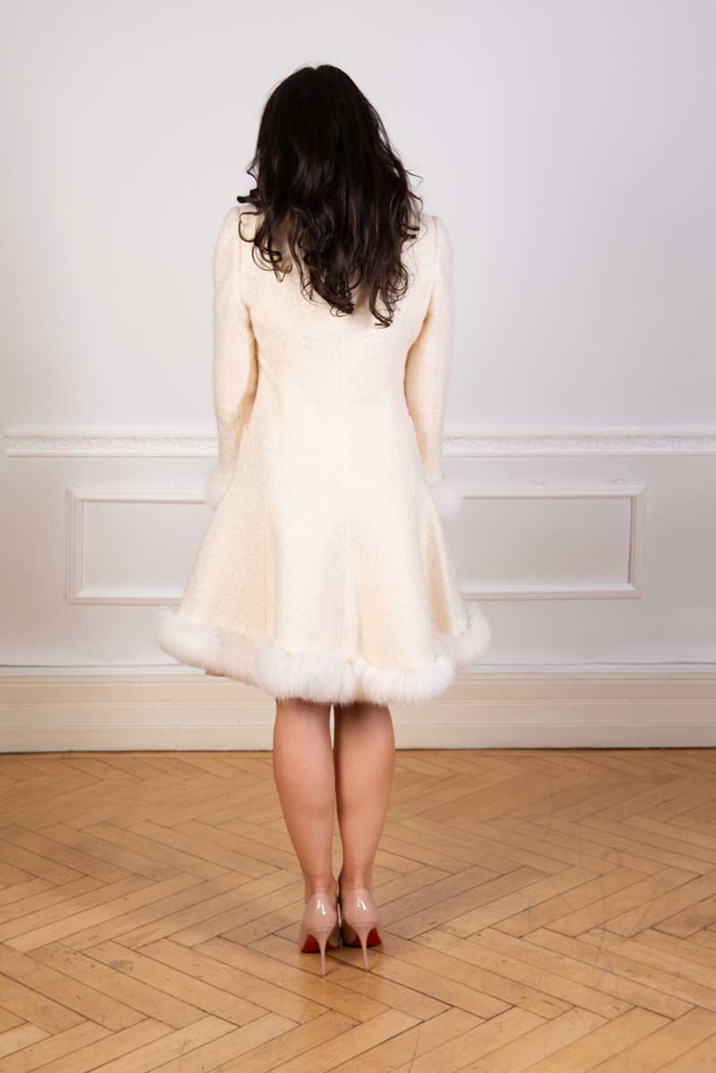 Mohair coat with white shadow fox and a flared skirt  seen from the back