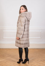 Load image into Gallery viewer, Saga Mink fur coat in natural pale silverblue for women seen from the back
